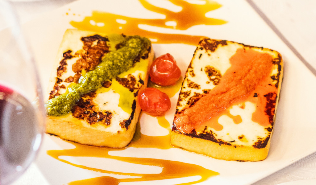 Cheese with green and red sauces and tomatoes, a typical dish of Tenerife.