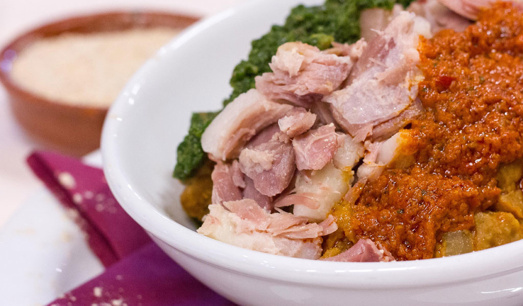 Pork dish with red and green mojo in a restaurant in Tenerife.