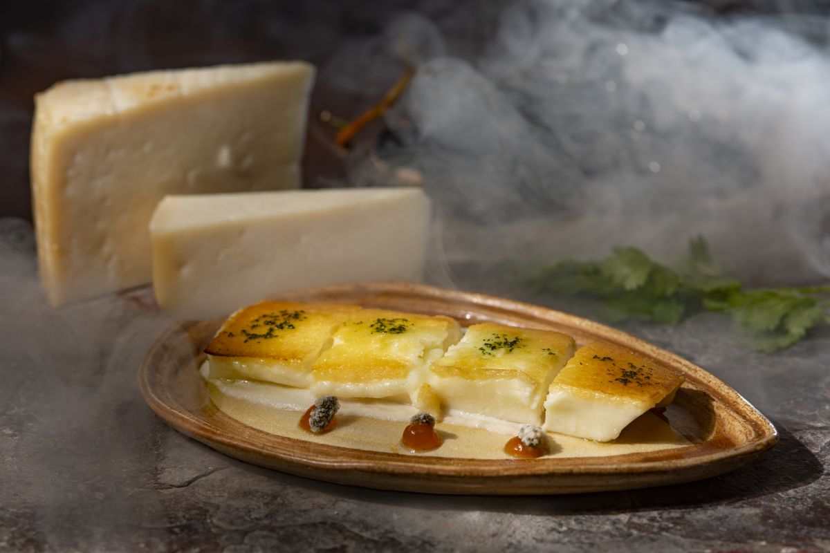 Grilled cheese with jam on a plate with a smoky background in Tenerife.