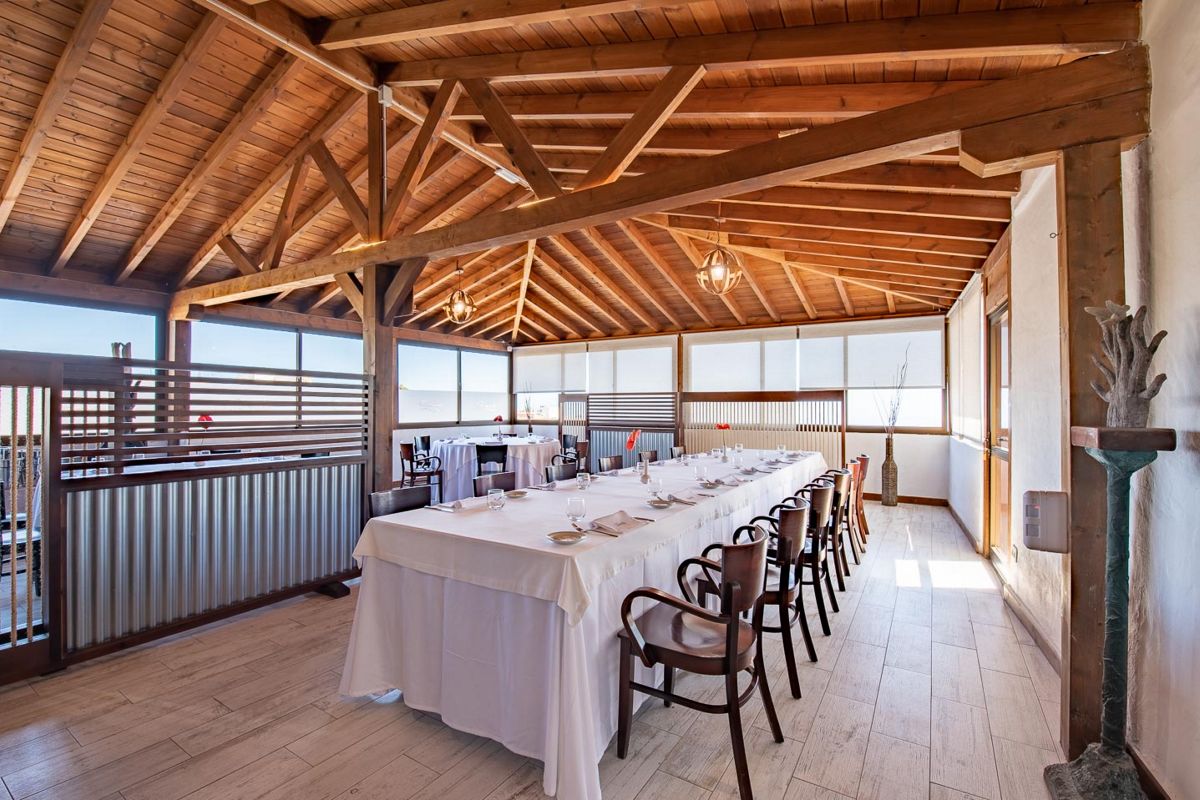 Long dining table prepared for an event in a restaurant in Tenerife.