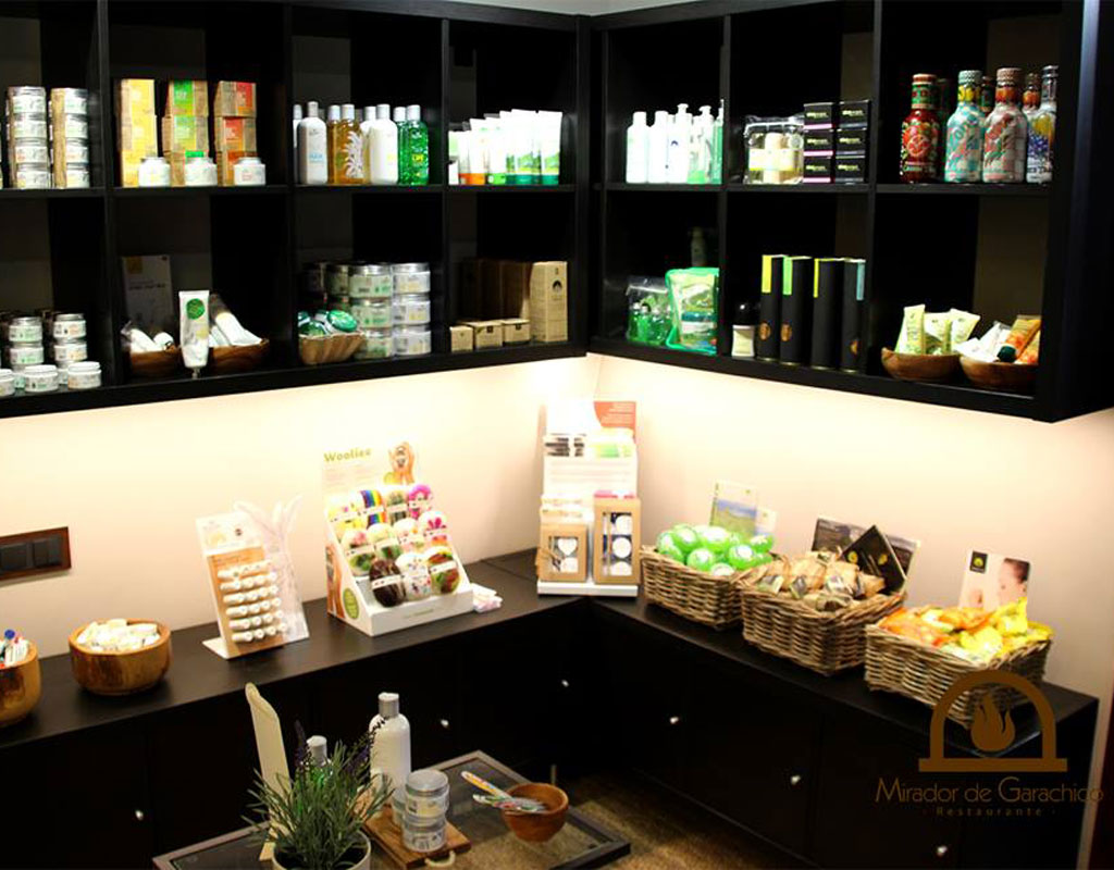 Shelves with various products and the logo of Mirador de Garachico Restaurant.