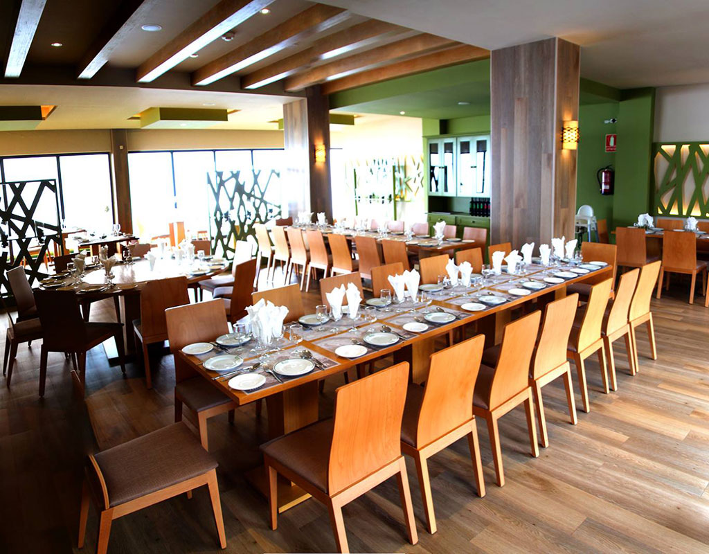 Elegant dining room with wooden tables and chairs prepared in Tenerife.