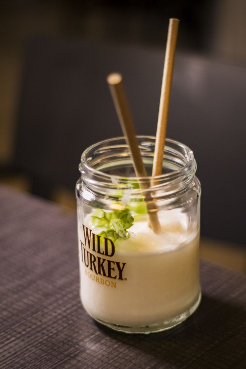 Liqueur glass with mint and straws on a coffee table in Tenerife.