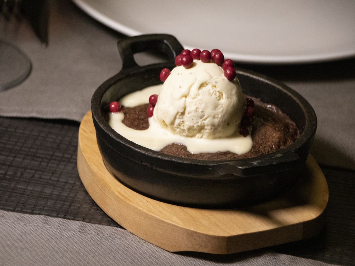 Ice cream with red fruits on a brownie on a plate in Tenerife.
