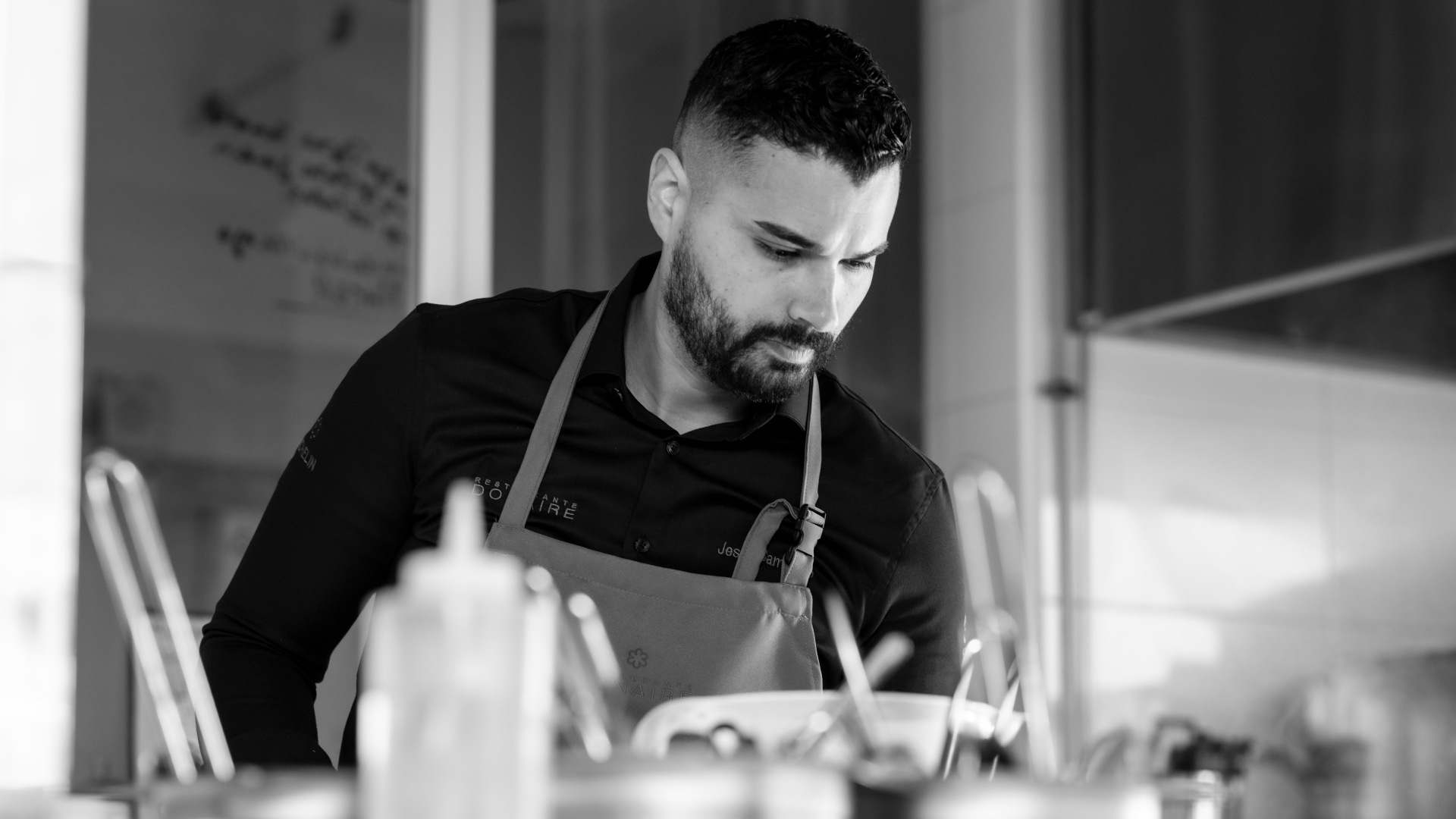 Chef in a restaurant kitchen in Tenerife, concentrating on his work.