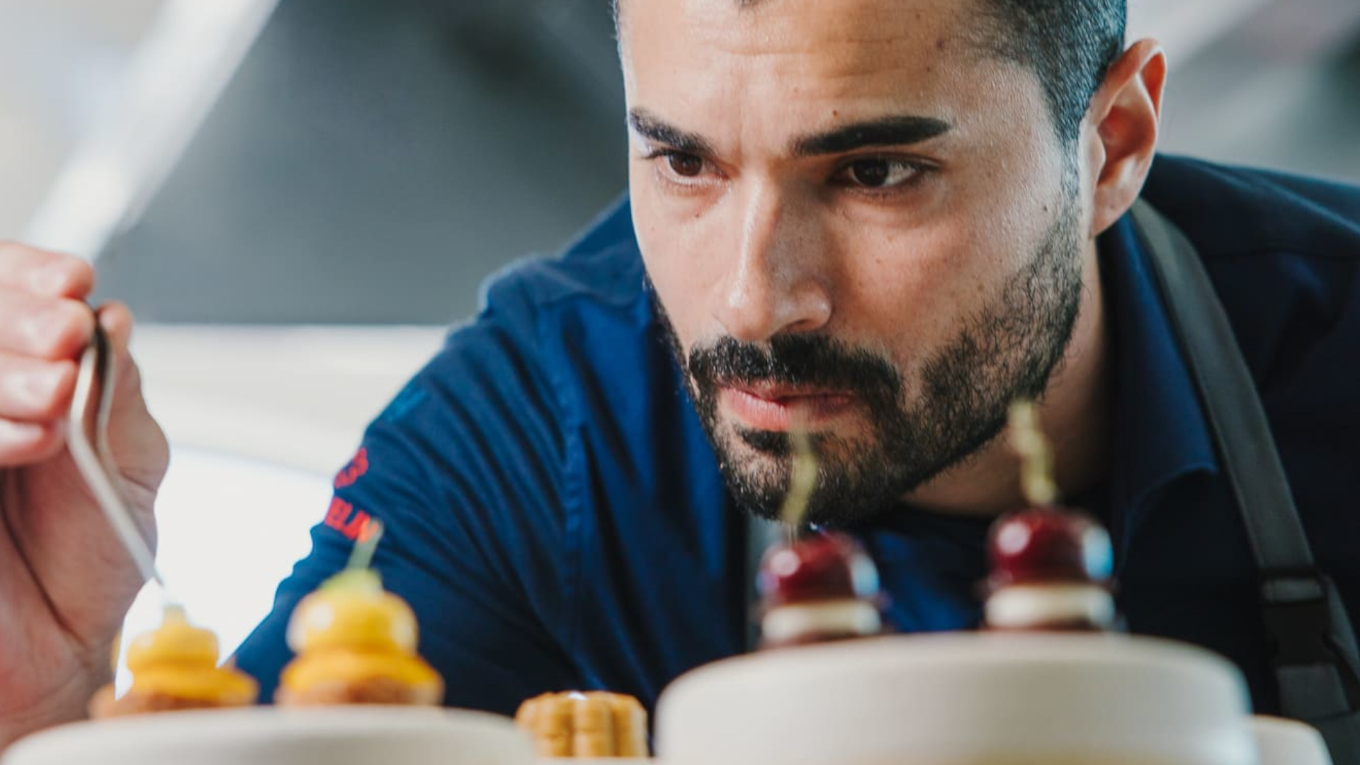 Concentrated chef decorating a dish in Tenerife.