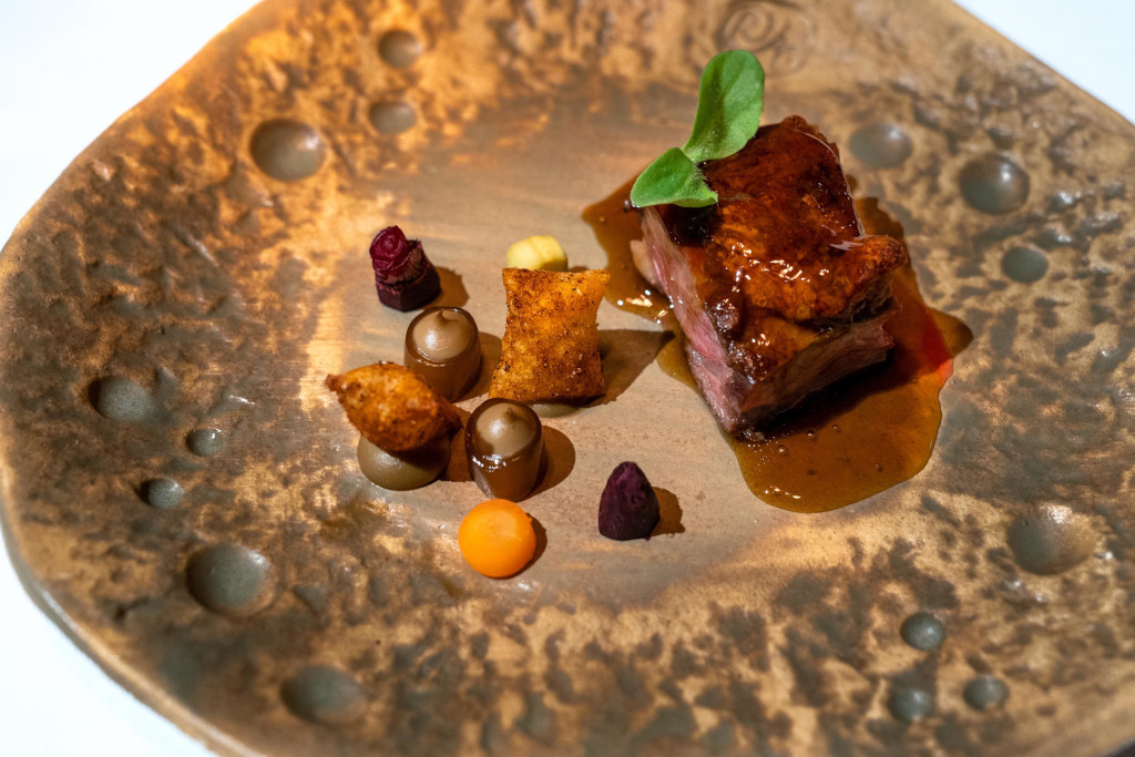 Gourmet dish with meat and side dishes in a restaurant in Tenerife.