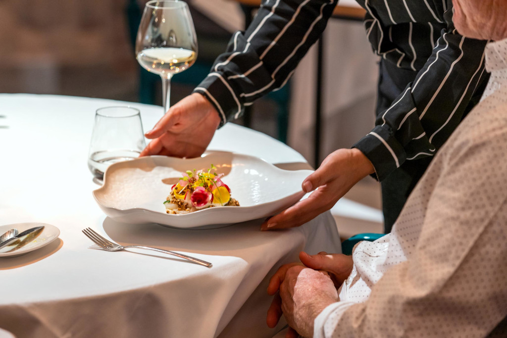 Serving an elegant plate of food in a restaurant in Tenerife.