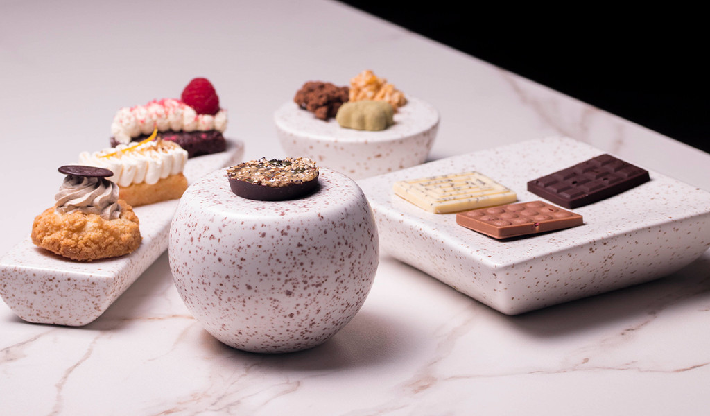 Desserts and assorted chocolates on ceramic plates, Tenerife.