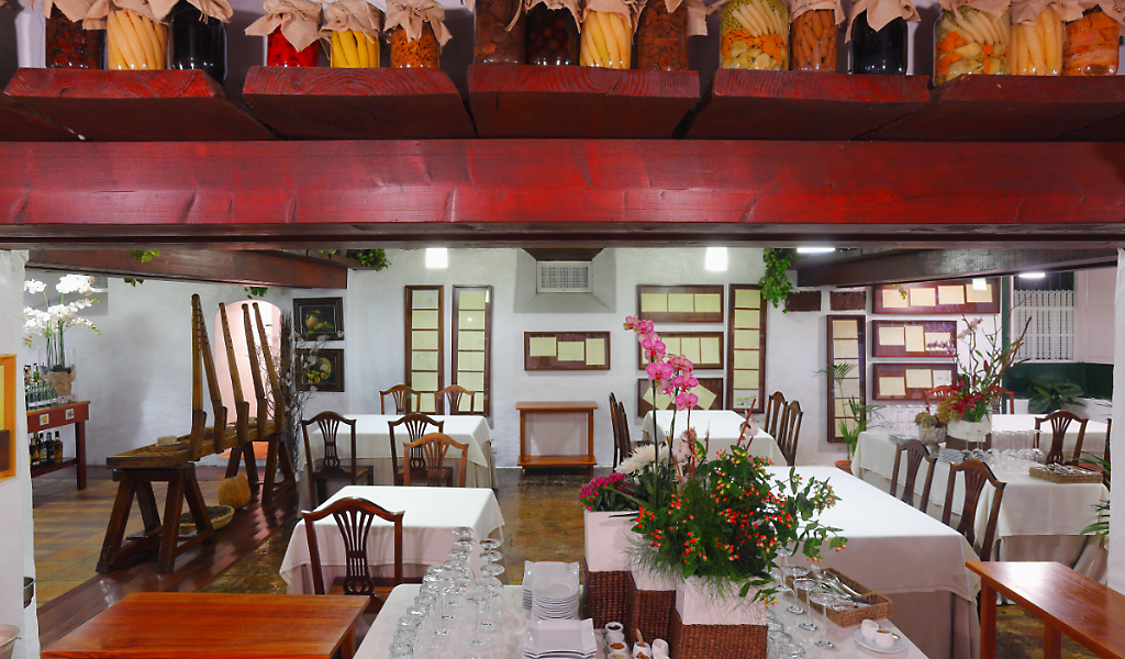 Restaurant in Tenerife with tables arranged and floral decorations.