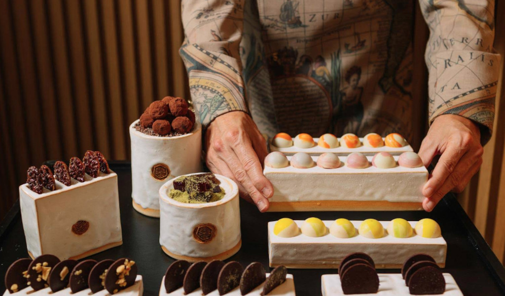 Sweets and truffles on ceramic trays at a stall in Tenerife.
