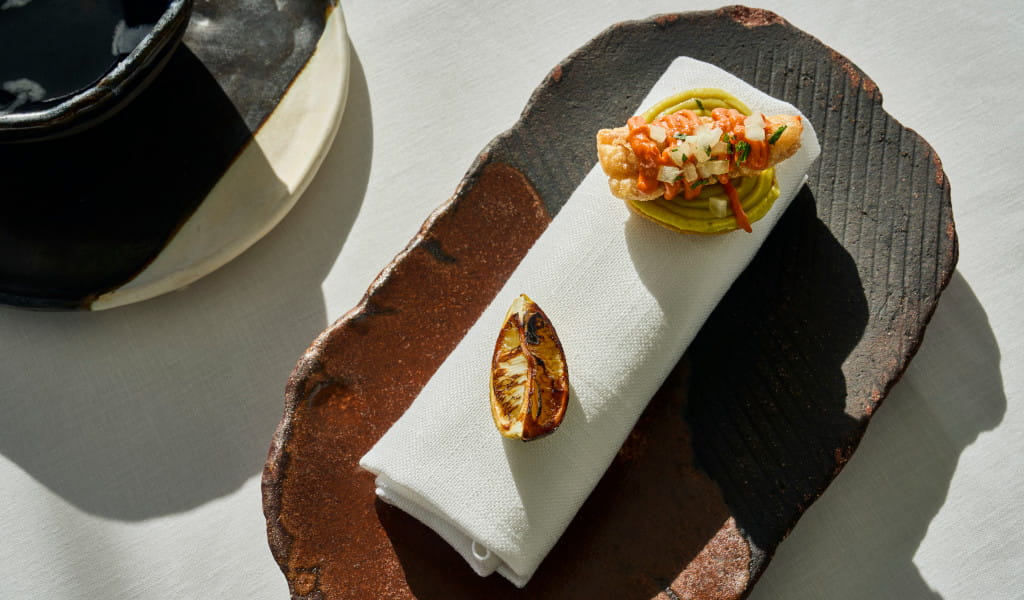 Shrimp taco on a plate on a rustic tray in Tenerife.