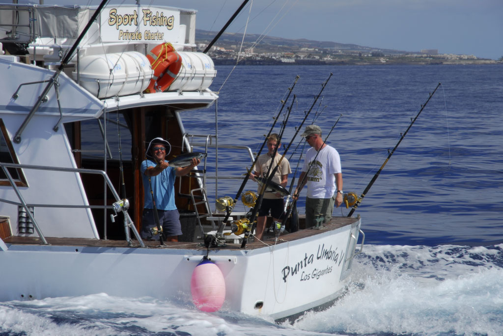 People fishing on a private charter boat in Los Gigantes, Tenerife.