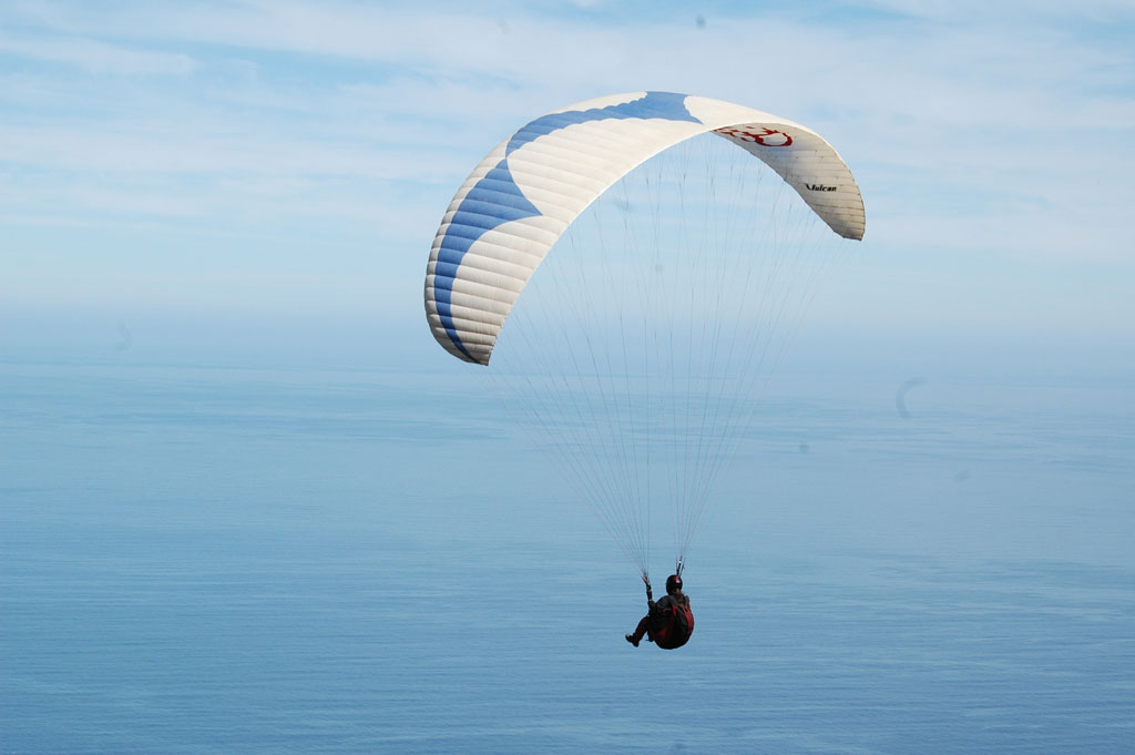 Person paragliding over the ocean in Tenerife.