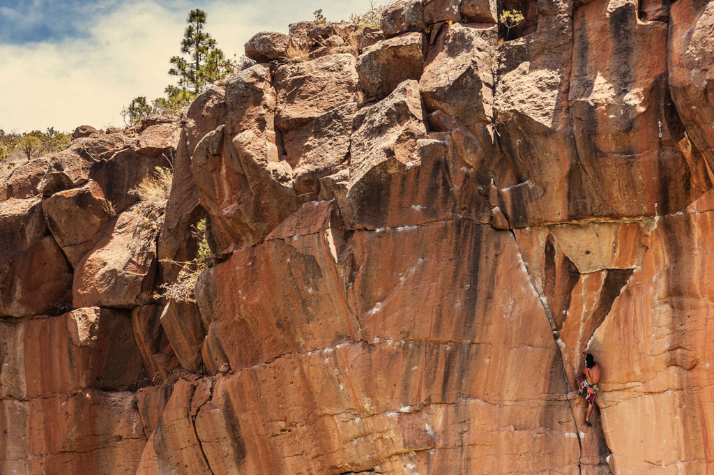 Climber on a rock face in Arico, Tenerife.
