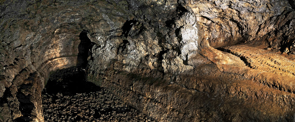 Lava cave in Icod de los Vinos, Tenerife, with illuminated rock formations.