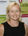 Person smiling in front of a poster for the Tenerife Ladies Open.