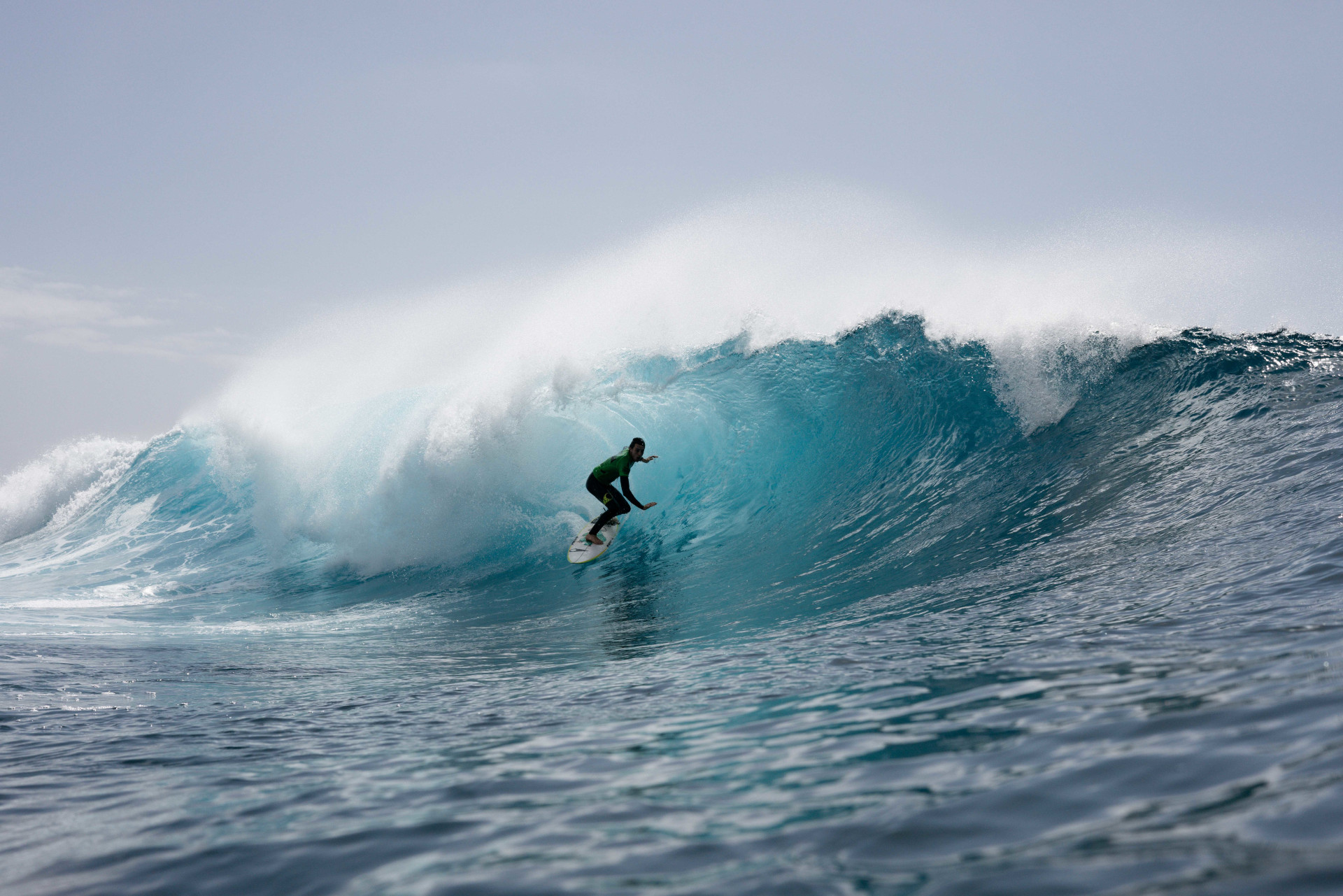 Surfer riding a wave on the coast of Tenerife.