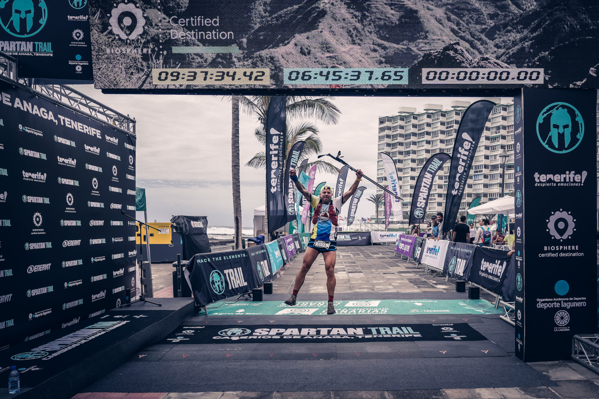 Runner crossing the finish line at the Spartan Trail race in Anaga, Tenerife.