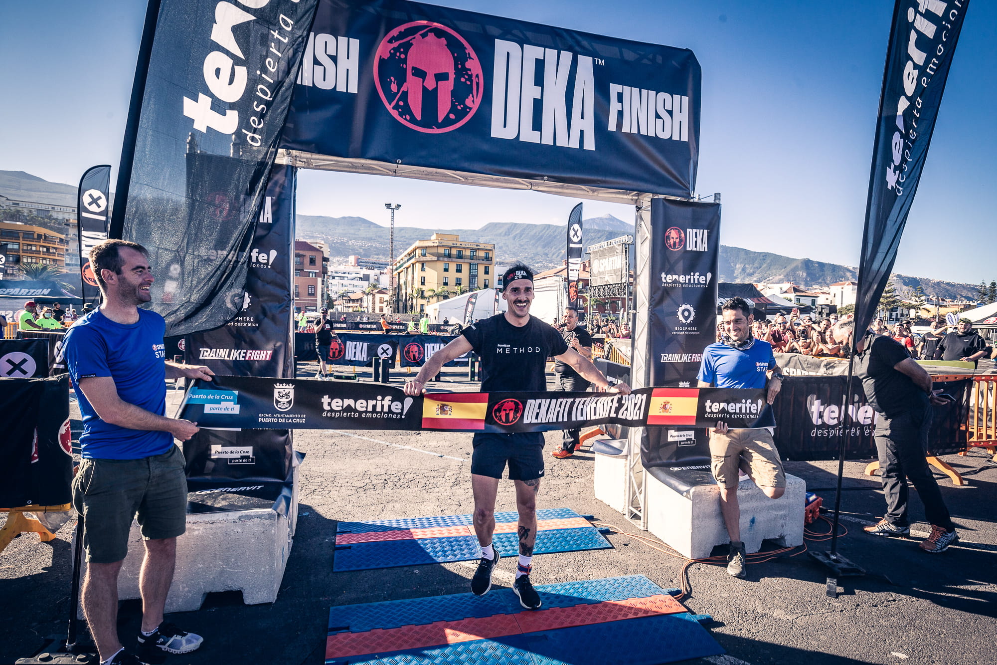 Runner crosses the finish line at DEKA Tenerife 2021 in Puerto de la Cruz.