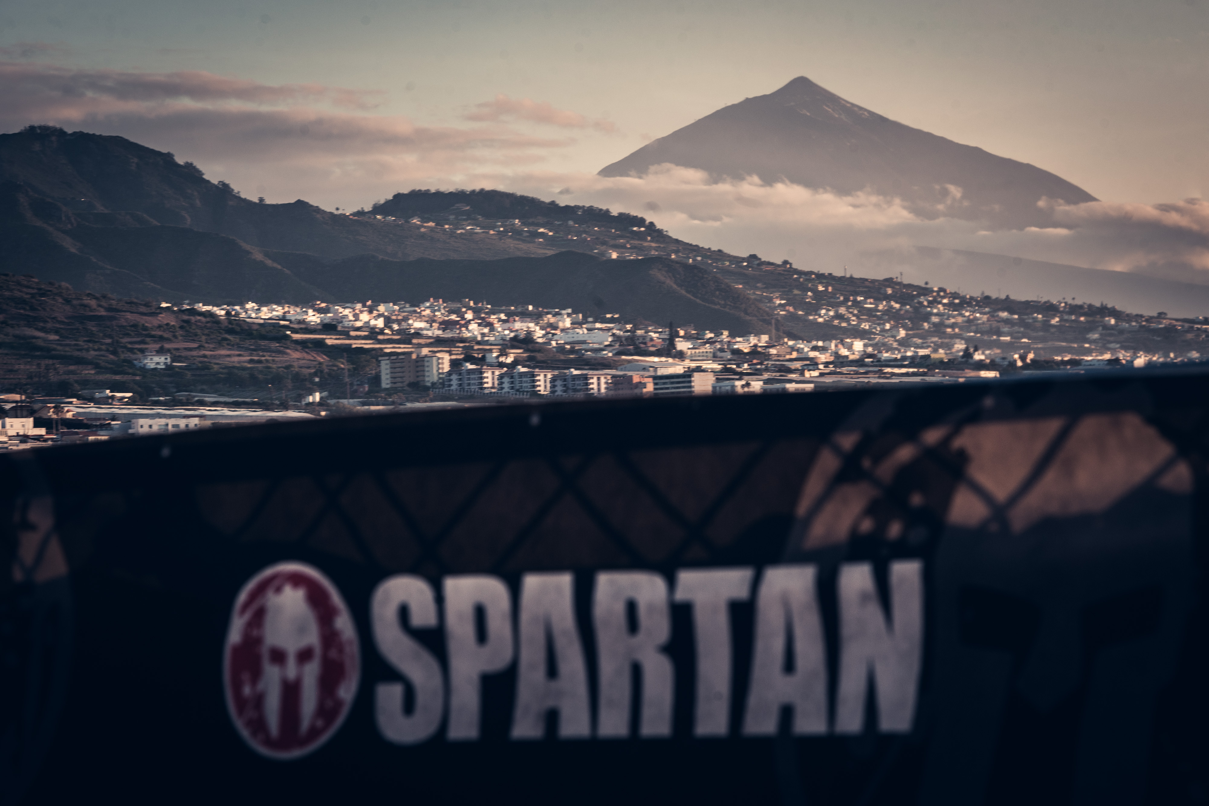 View of the city with Mount Teide in the background and Spartan sign in the foreground. Tenerife.