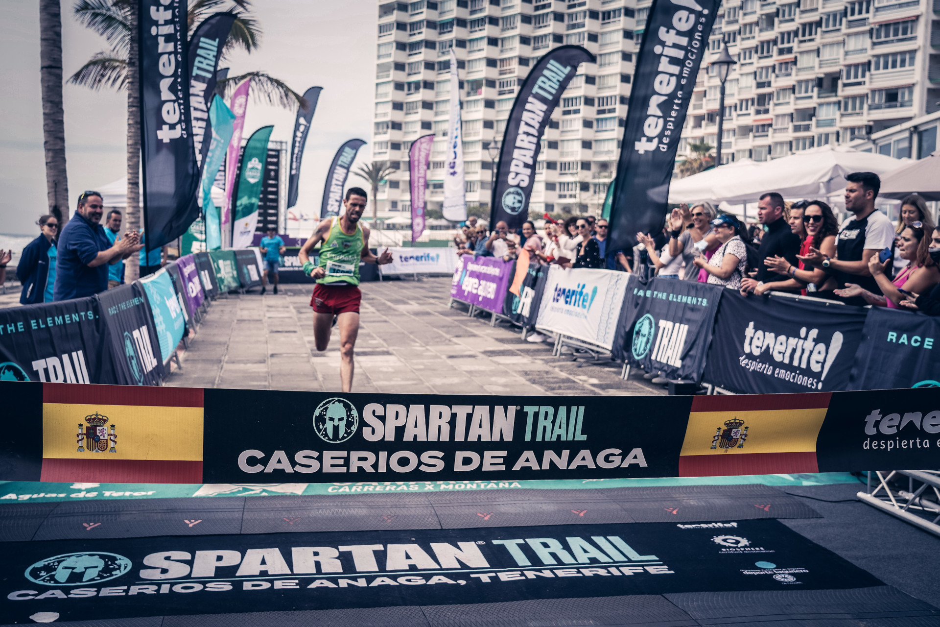 Runner crossing the finish line at Spartan Trail Caseríos de Anaga, Tenerife.