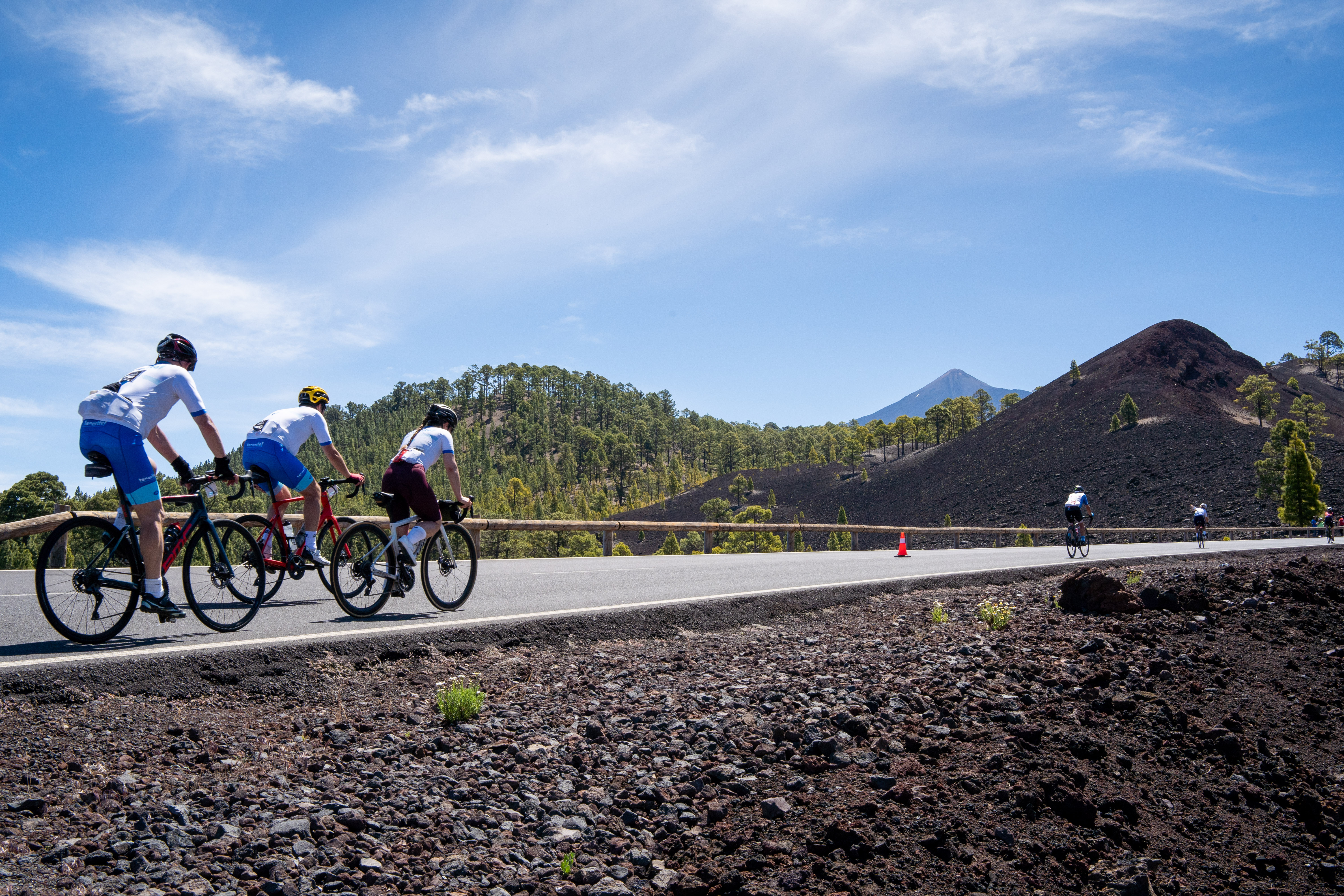 Cyclists climbing a road in Teide National Park, Tenerife.