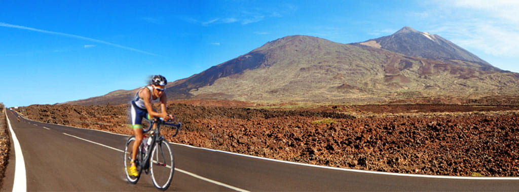 Road cyclist next to Mount Teide in Tenerife.