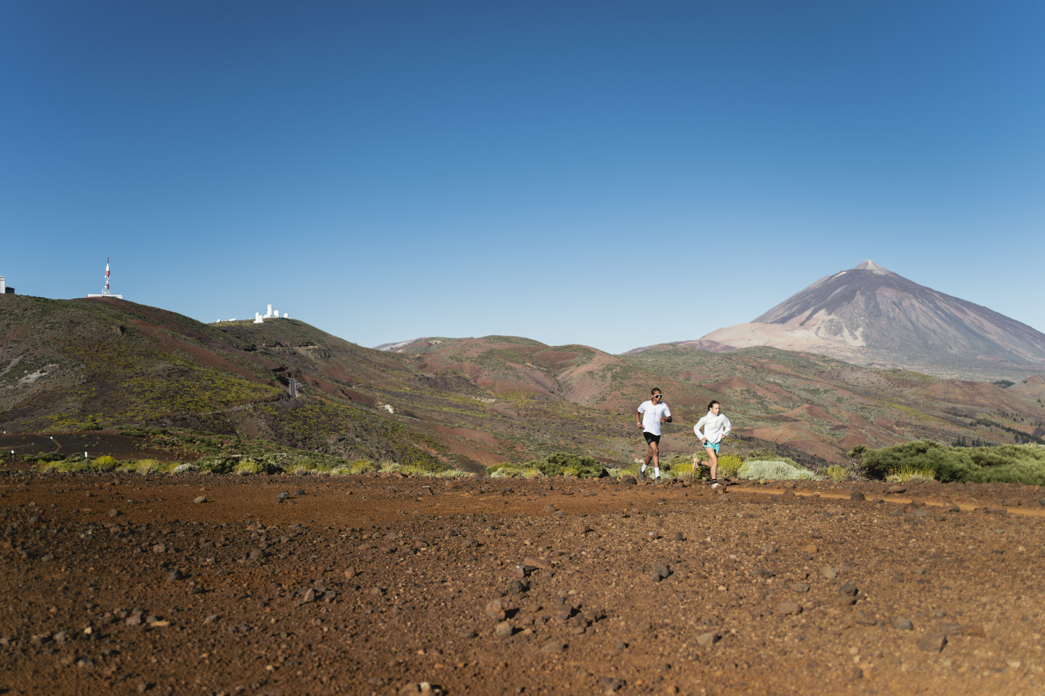 People running with a view of Mount Teide in Tenerife.