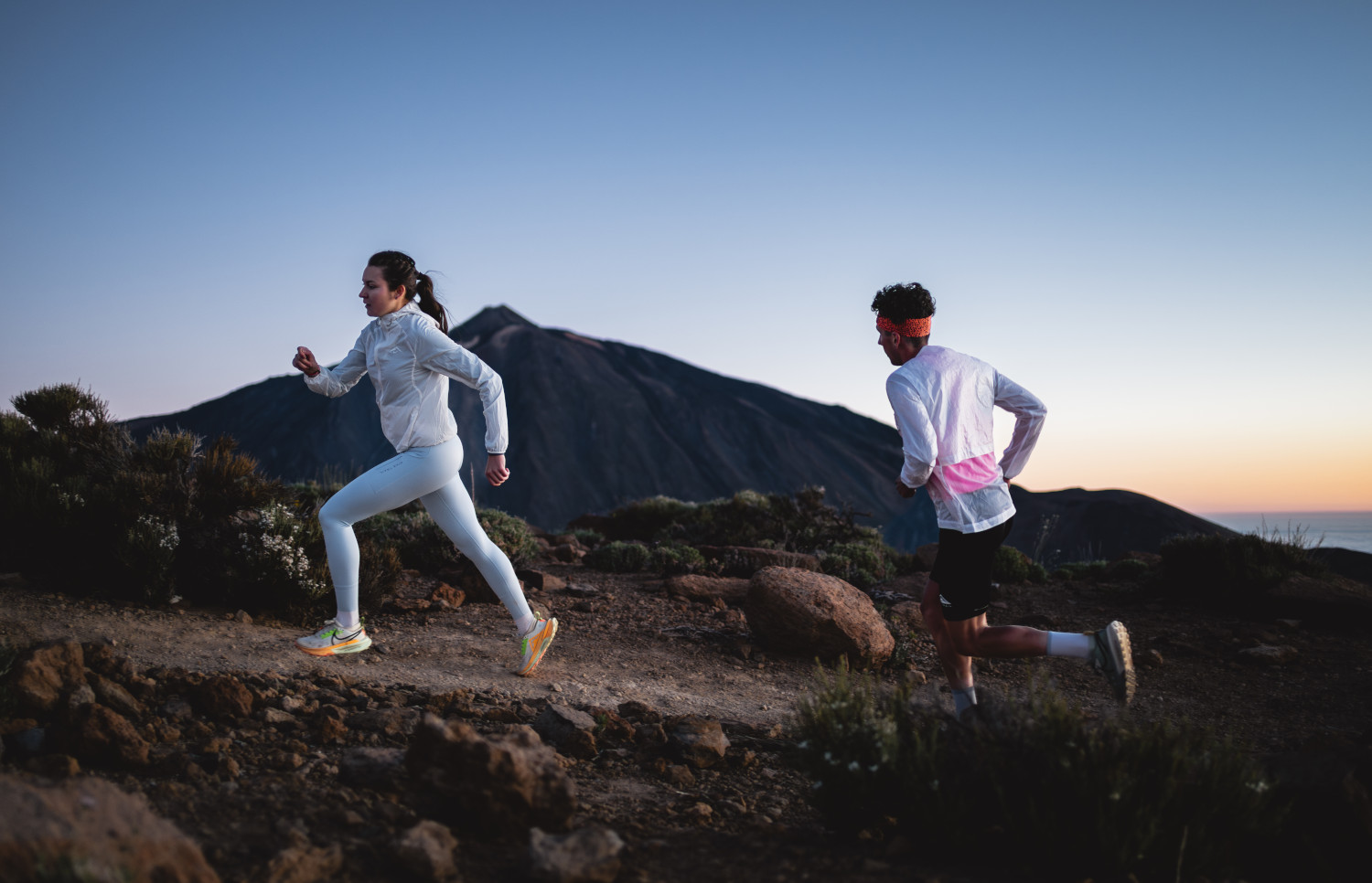 People running at dawn near Mount Teide in Tenerife.