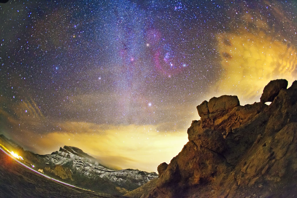 Starry sky over rocks in night landscape of Teide National Park, Tenerife.