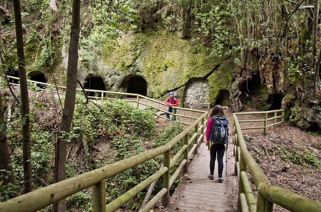 Trail with people and caves in Anaga, Tenerife.