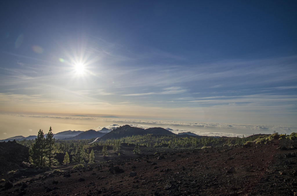 Mountainous landscape of Teide National Park with clear skies and bright sunshine.