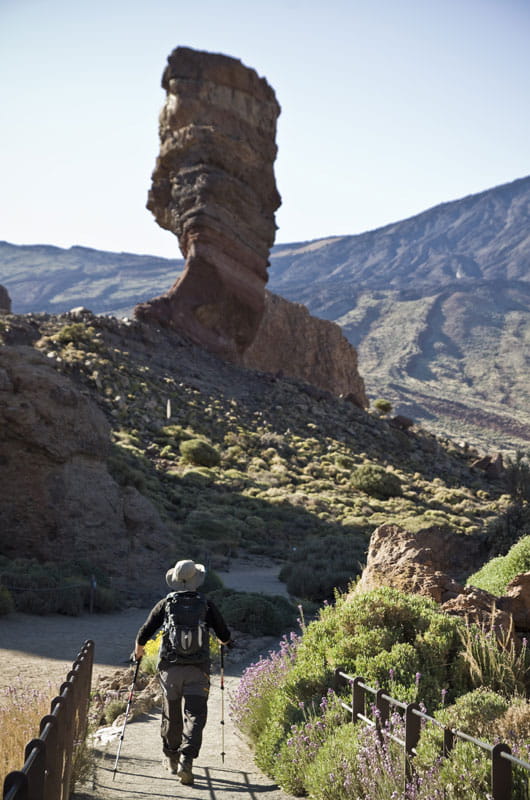 Person walking towards Roque Cinchado on Mount Teide, Tenerife.