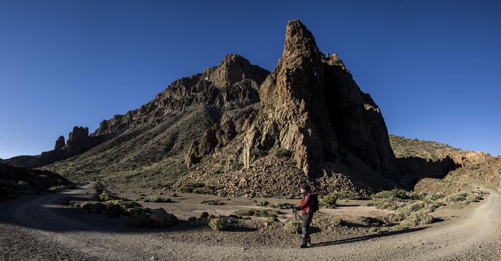Hiker in front of a rock formation in the Teide National Park, Tenerife.