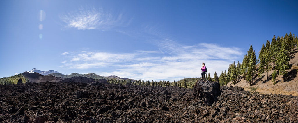 Volcanic landscape with person in Teide National Park, Tenerife.