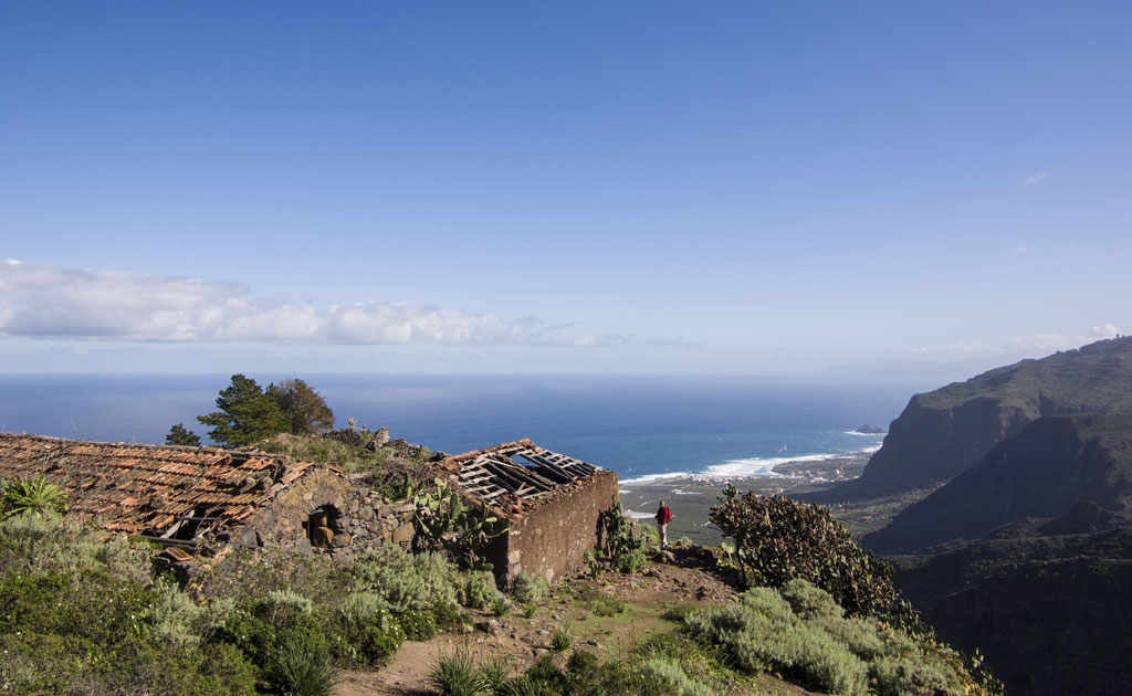 Ruined stone house overlooking the ocean and mountains in Tenerife.