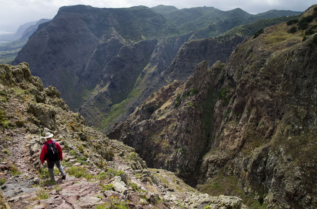 Person walking along a mountain trail in Anaga, Tenerife.