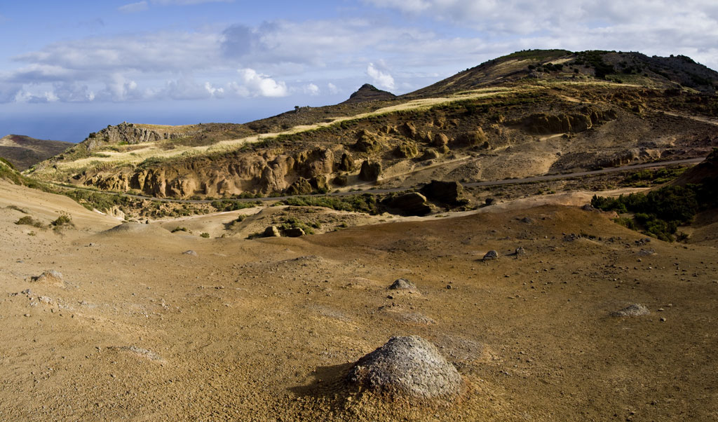 Arid and mountainous landscape in Tenerife under a cloudy sky.