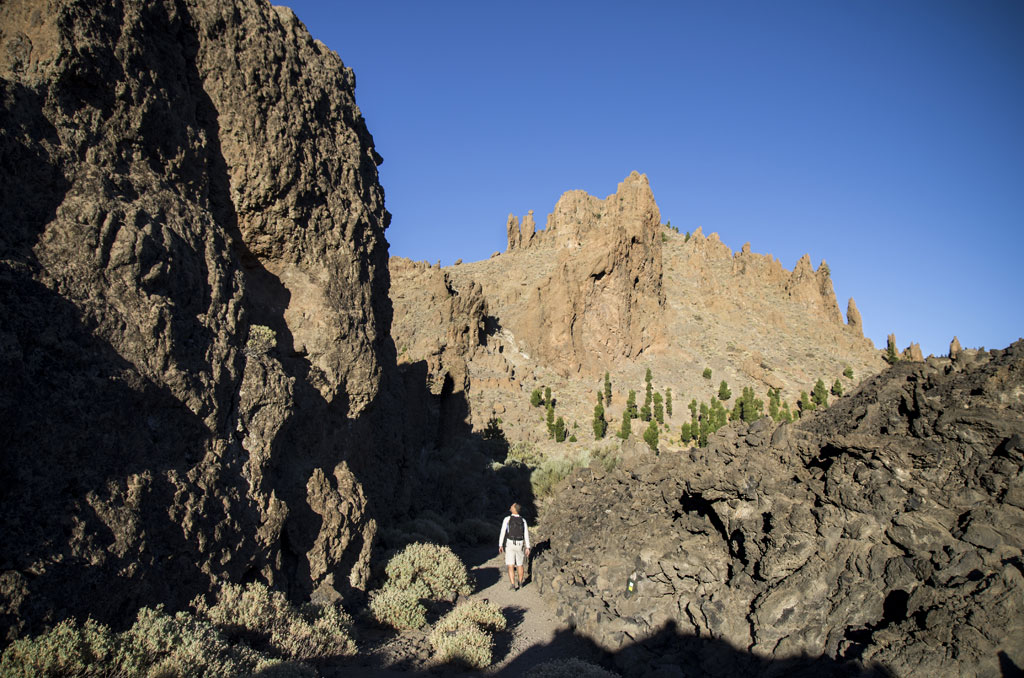 Rocky trail in Teide National Park, Tenerife, with mountains in the background.
