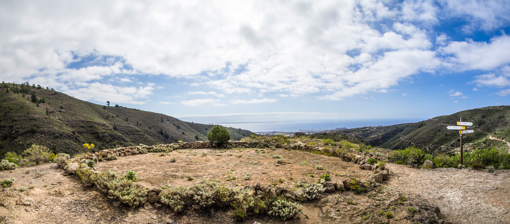 Viewpoint in the mountains of Tenerife with sea views and direction signs.