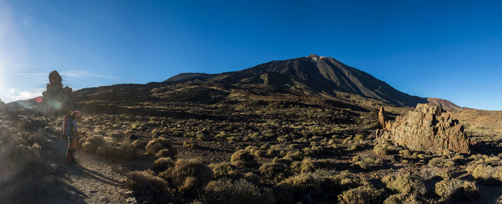 Path to Mount Teide at dawn, with mountains and typical vegetation of Tenerife.