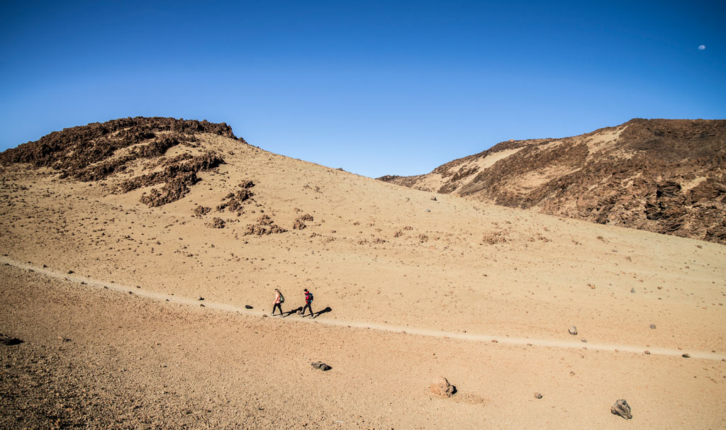 People walking in the mountains of Teide National Park, Tenerife.