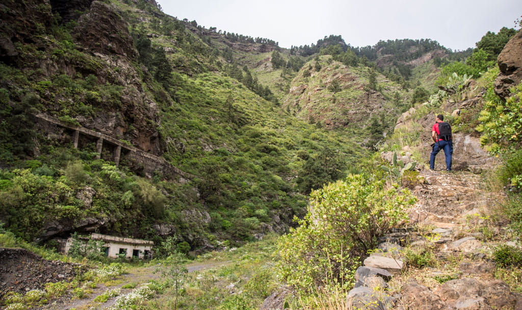 Mountain trail with hiker in the Barranco de Masca, Tenerife.