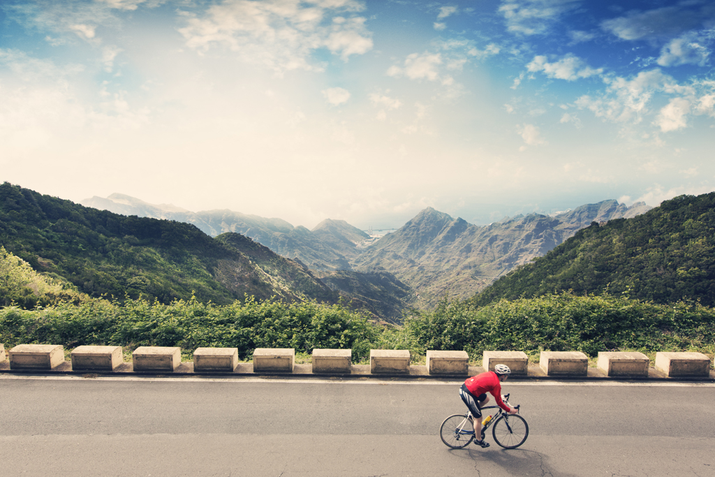Cyclist riding a mountainous road in Anaga, Tenerife.