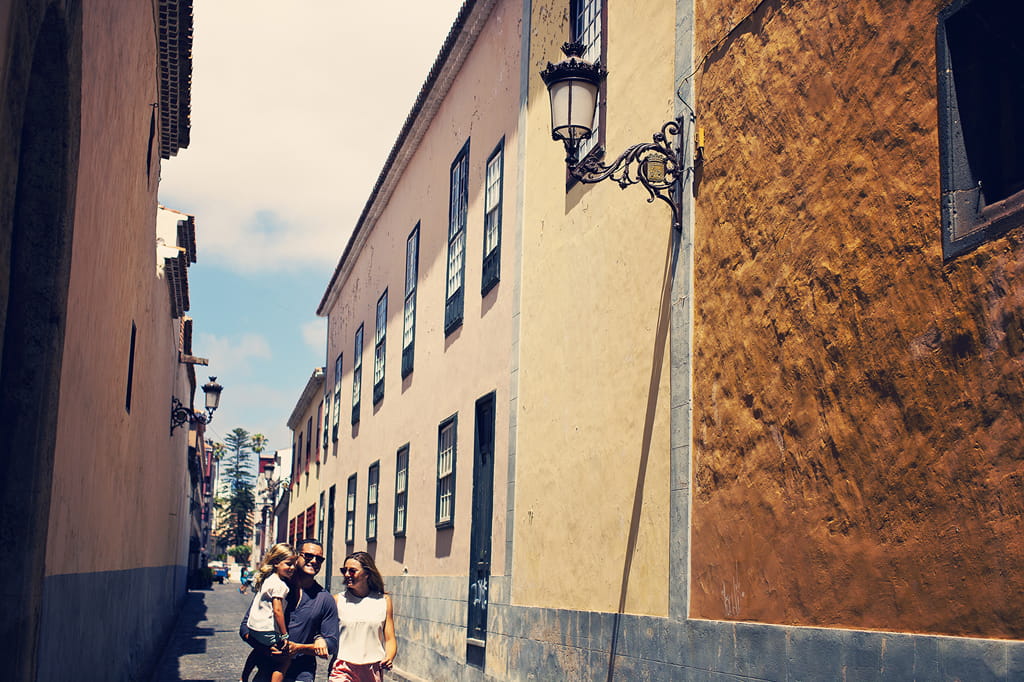 Family walking down a narrow street in La Laguna, Tenerife.