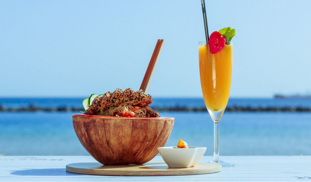 Salad and drink platter on the beach in Tenerife.