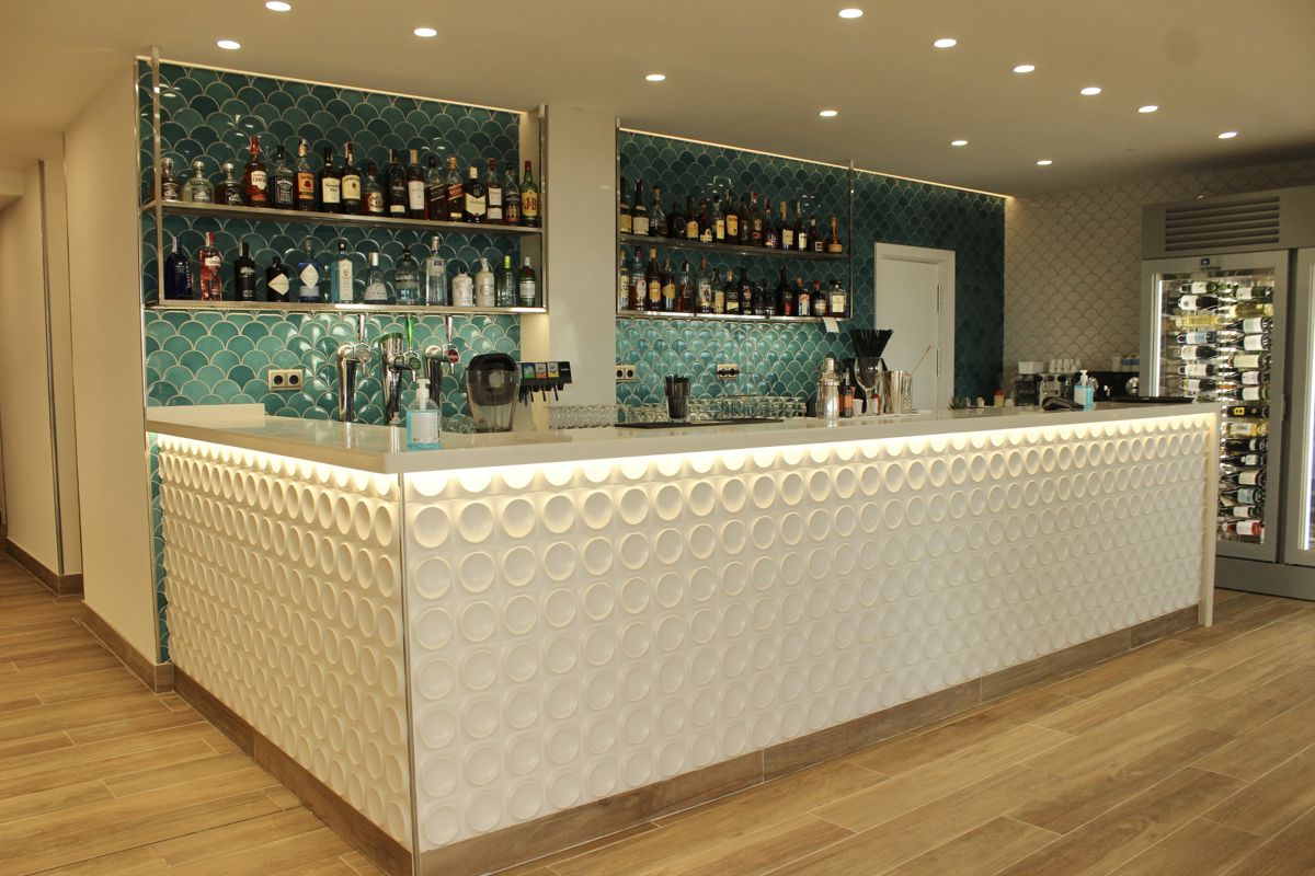 Bar counter with bottles and modern décor in Tenerife.