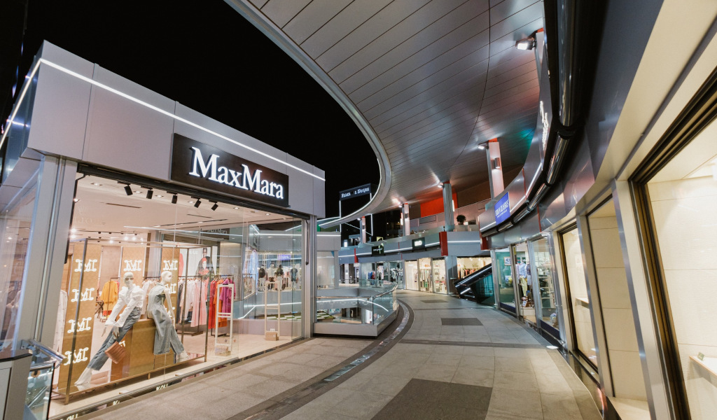 MaxMara store in a shopping center in Tenerife at night.