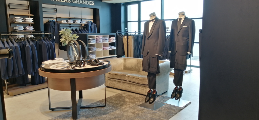 Costumes on display in fashion store in Tenerife. Plus sizes visible above.
